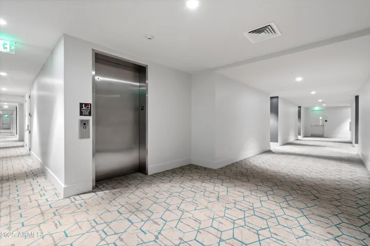 6th Floor Elevator Entry, Condo is 2 doors down to the right