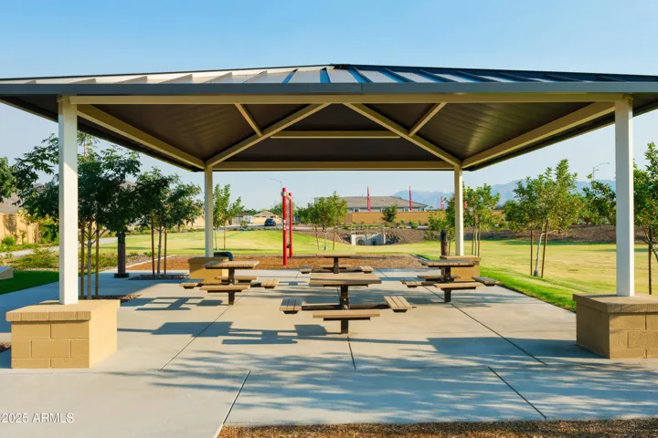PLAY PARK WITH ROCK CLIMBING, SWINGS, CORN HOLE AND PICNIC AREAS.