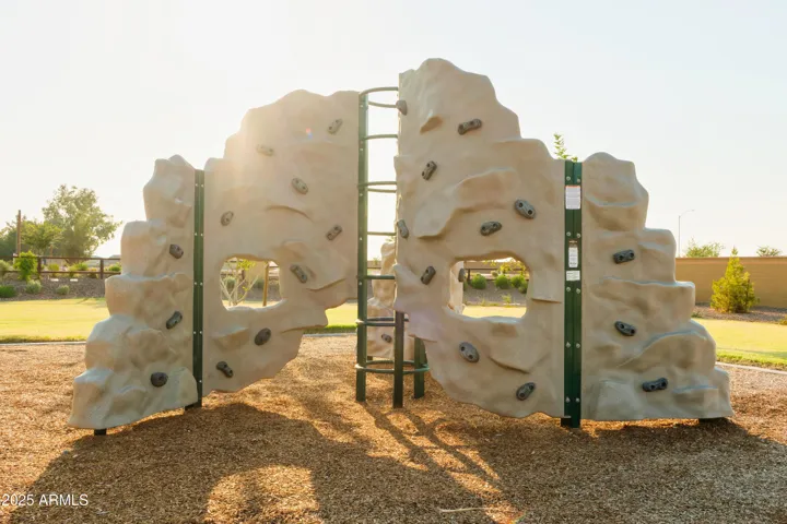 PLAY PARK WITH ROCK CLIMBING, SWINGS, CORN HOLE AND PICNIC AREAS.