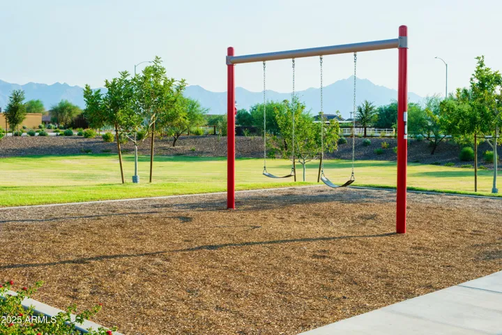 PLAY PARK WITH ROCK CLIMBING, SWINGS, CORN HOLE AND PICNIC AREAS.