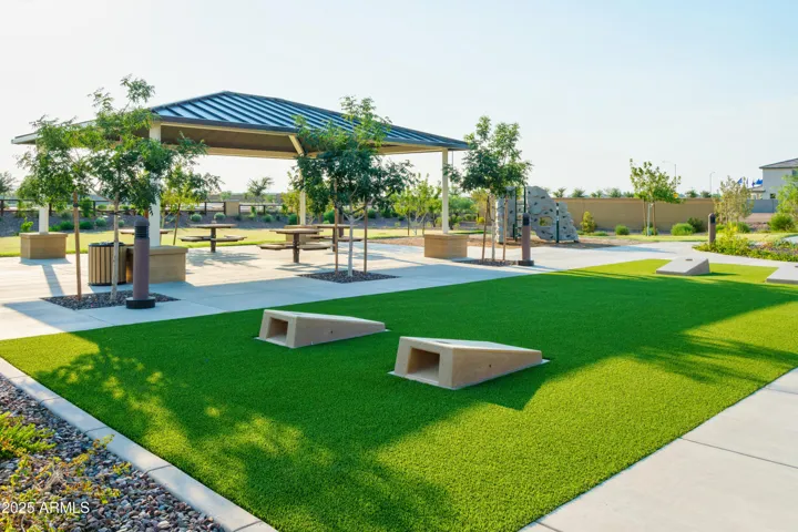 PLAY PARK WITH ROCK CLIMBING, SWINGS, CORN HOLE AND PICNIC AREAS.