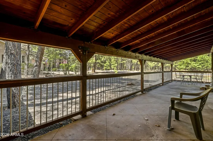 Expansive covered front porch ideal for relaxing and enjoying the mountain setting.
