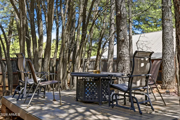 Large, private backyard with mature trees and plenty of space to enjoy the outdoors.