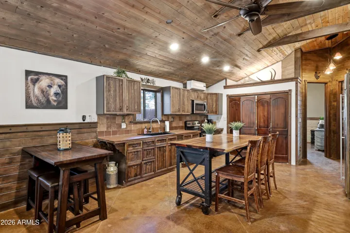 Spacious living area flowing into the kitchen and dining space, perfect for entertaining.