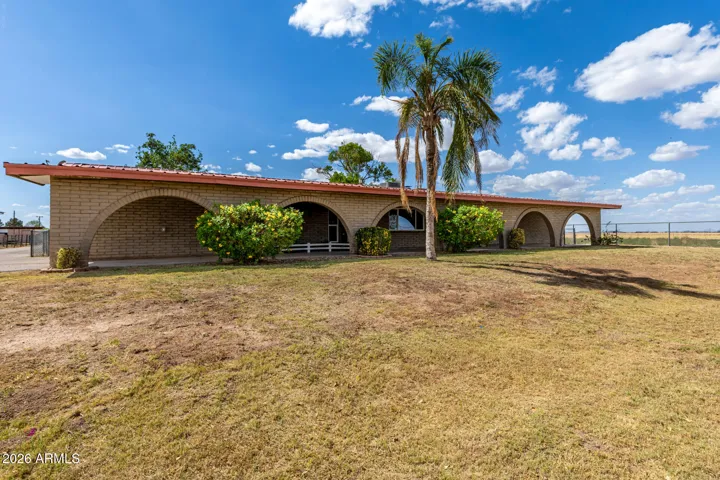 Front of the ranch style home with huge front yard