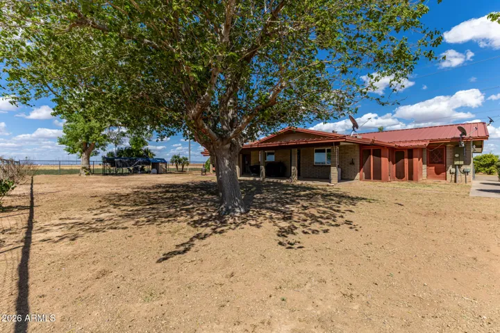 Full Backyard view with large mature shade trees
