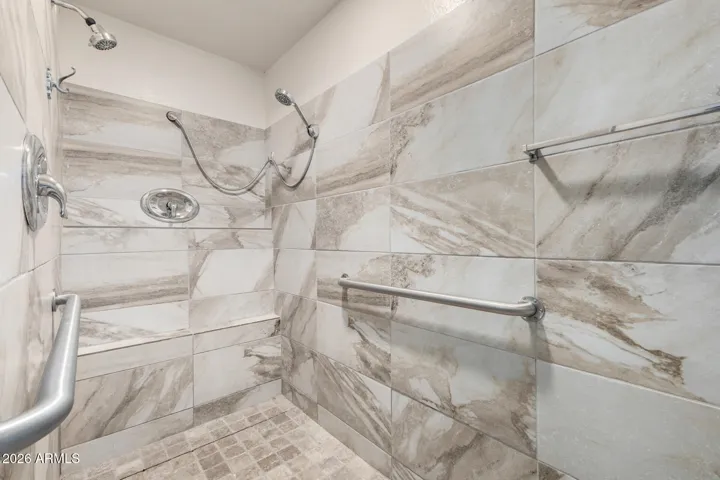 Huge Walk in Primary Bath Shower with double heads, bench and drying area