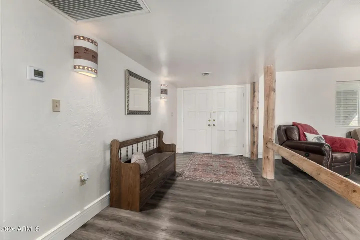 Inside front entry. Light and bright with custom peeled poles