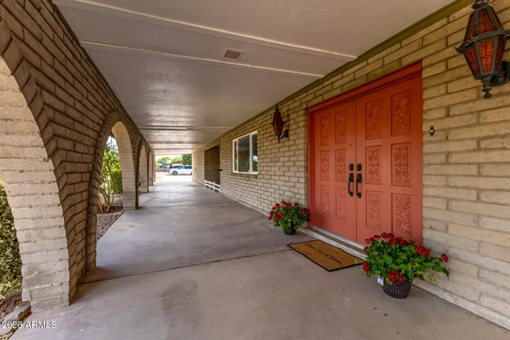 Double Door front entry with patio the length of the home