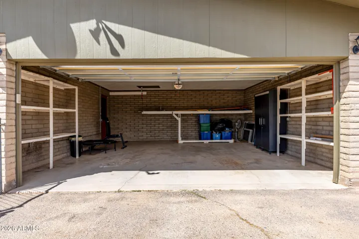 2 Car Garage with plenty of shelving
