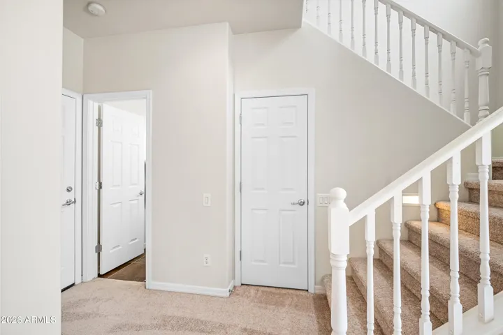 Half bath downstairs with garage door and linen closet