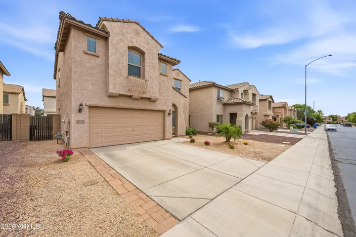 Welcome home to this charming two-story Mesa property offering great curb appeal, low-maintenance desert landscaping, and a spacious two-car garage. With its warm stucco exterior, tile roof accents, and inviting front entry, this home makes a strong first impression in a clean, sidewalk-lined neighborhood.