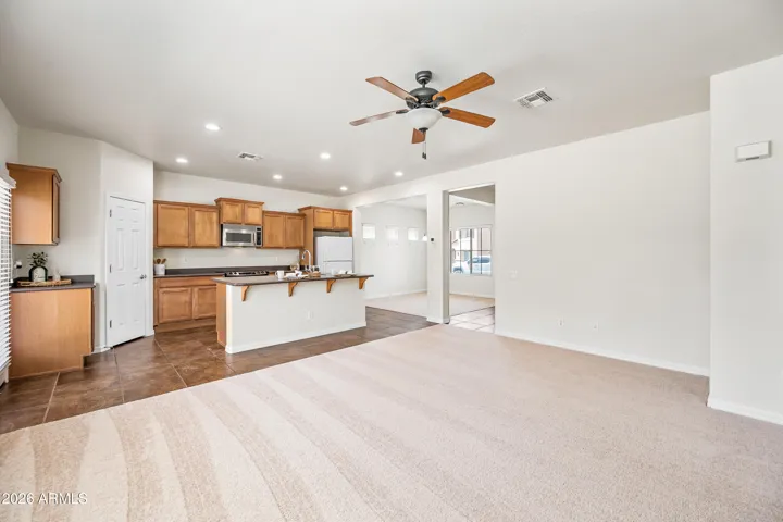 All purpose living, kitchen, pantry, and dining spaces