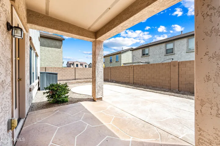 Seamless outdoor transition to covered patio, ready for your personal touches and entertaining guests