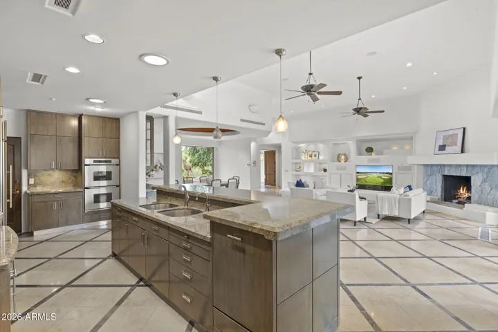 KITCHEN LOOKING TOWARD FRONT DOOR, LIVING AND DINING