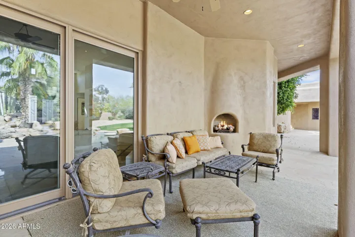 COZY OUTDOOR FIREPLACE WITH SEATING AREA