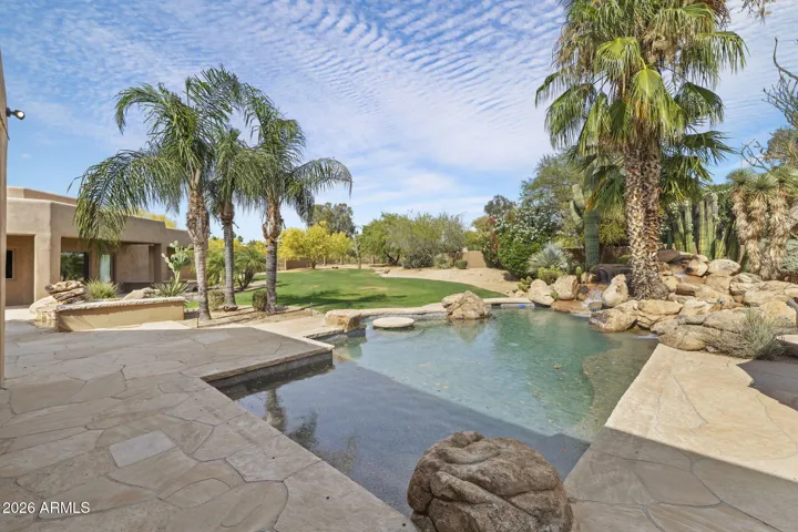 DUAL WATERFALL POOL AND HOT TUB WITH LARGE YARD
