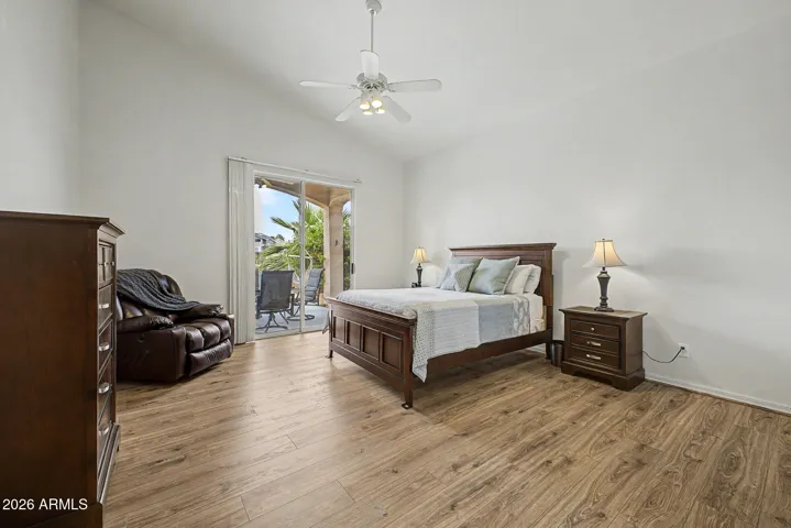 Private primary suite with walk out to the patio, the lake is always there.