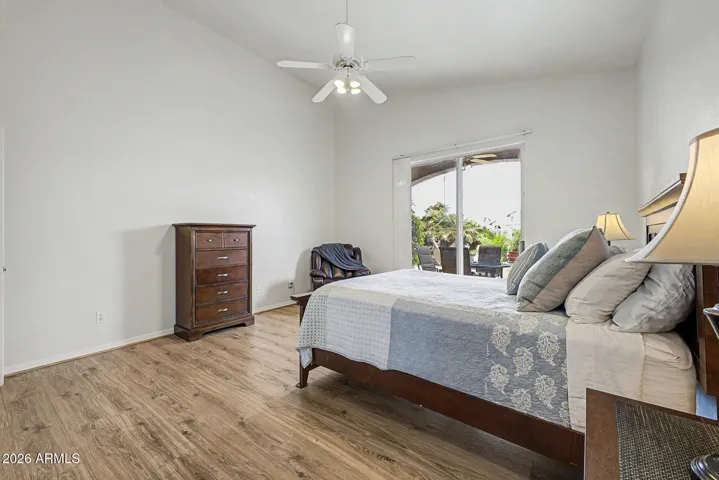 Primary suite vaulted ceilings, cooling fan, newer vinyl flooring.