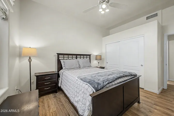 Sliding doors to closet, ceiling fan to cool. Welcoming.