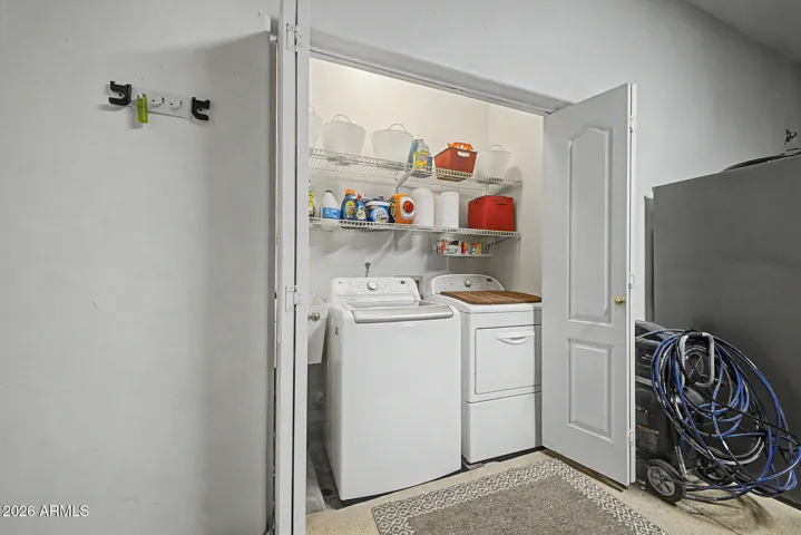 Both washer and dryer are included with this lovely home. Additional shelving always a plus.