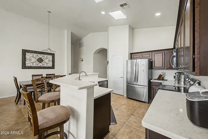 Chat from the island while you cook, stainless appliances, fridge included.