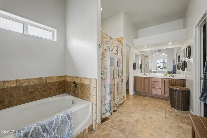 Primary ensuite includes tile floors and desirable separate garden tub and shower.