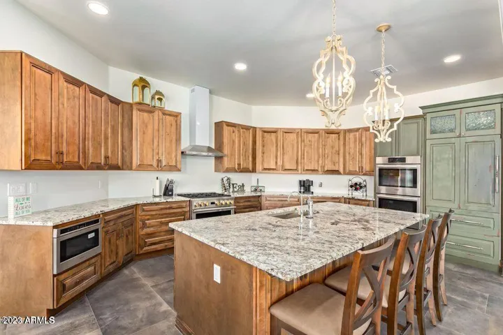 CUSTOM SUB ZERO AND DOUBLE BOSCHE OVENS, DOUBLE THERMADORE REFRIG DRAWERS, LG DISHWASHER, MONOGRAM GAS RANGE AND MONOGRAM DRAWER MICROWAVE