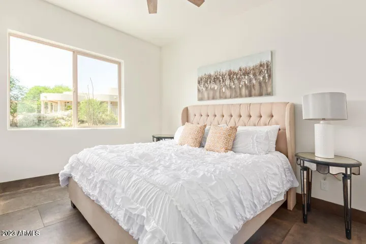 BEDROOM TWO - HAS SHADES AND VIEW OF BACKYARD.