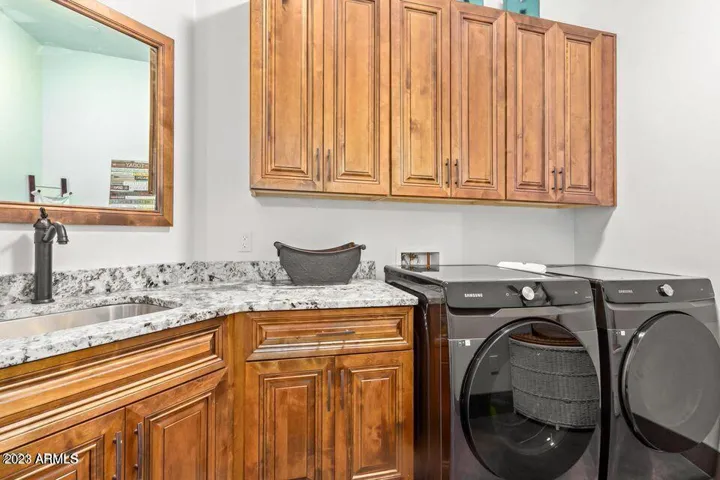 LAUNDRY ROOM W/SINK AND CABINETRY