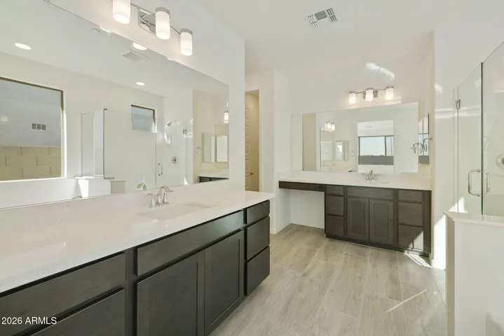 DUAL VANITIES, TUB, SHOWER LOTS OF STORAGE AND LARGE WALK IN CLOSET.