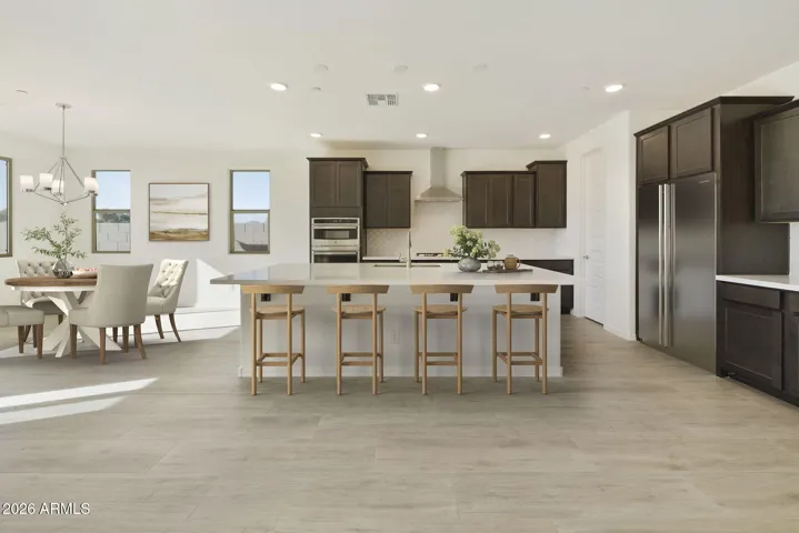 BEAUTIFUL SLATE GOURMET KITCHEN CABINETS, BUILT-IN APPLIANCES LARGE QUARTZ COUNTERS AND DESIGNER BACK TILED BACKSPLASH