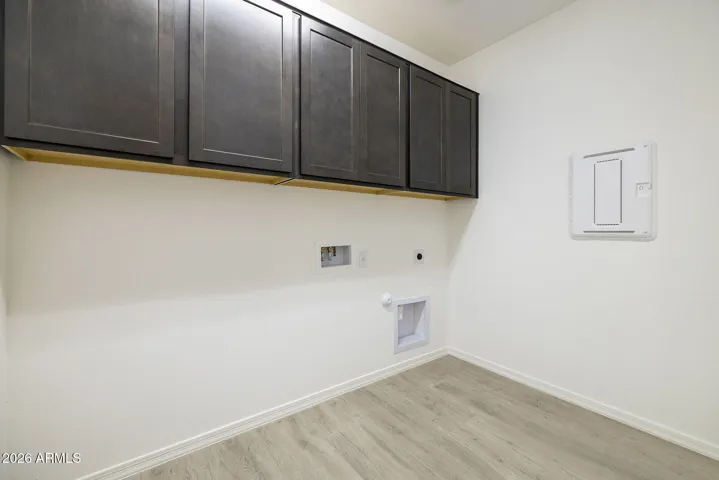 LAUNDRY ROOM WITH UPPER CABINETS