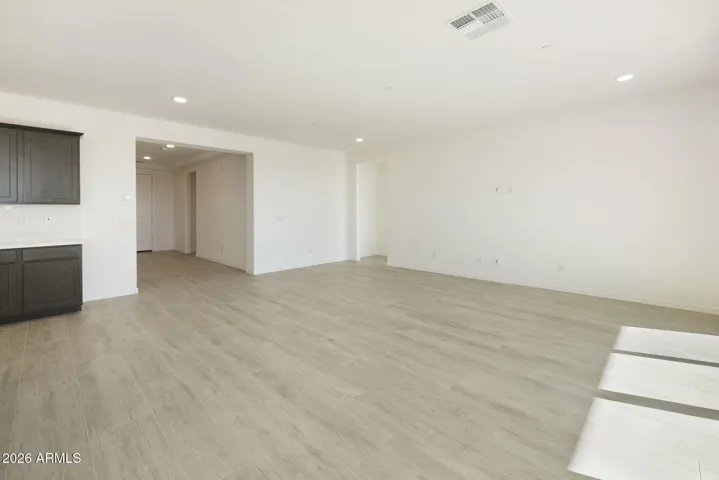 BEAUTIFUL WOOD PLANK TILE FLOORING THAT RUNS THROUGH THE HOME MINUS THE BEDROOMS.