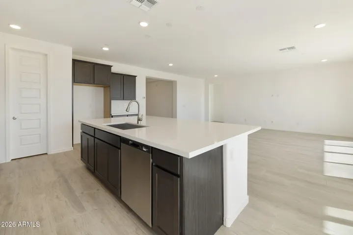 BEAUTIFUL SLATE GOURMET KITCHEN CABINETS, BUILT-IN APPLIANCES LARGE QUARTZ COUNTERS AND DESIGNER BACK TILED BACKSPLASH