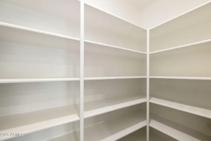 PAINTED CABINETS, QUARTZ COUNTERS, DESIGNER BACKSPLASH, STAINLESS STEEL APPLIANCES AND LARGE WALK IN PANTRY