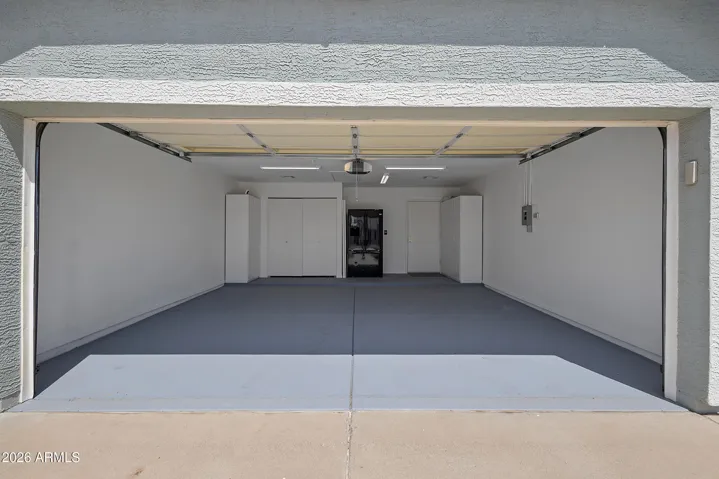 Spacious garage for parking, storage, or a workshop.