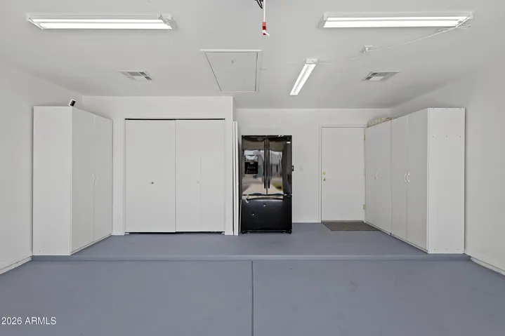Spacious garage for parking, storage, or a workshop.
