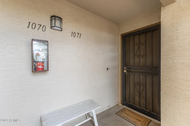 Ground Floor Front Door with Bench and Security Door to Open Door with Beautiful Weather