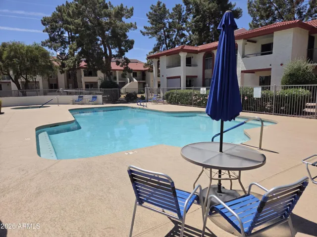 Relaxing Pool with Tables and Chairs