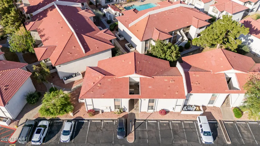 Looking at Condo Building and Parking from above