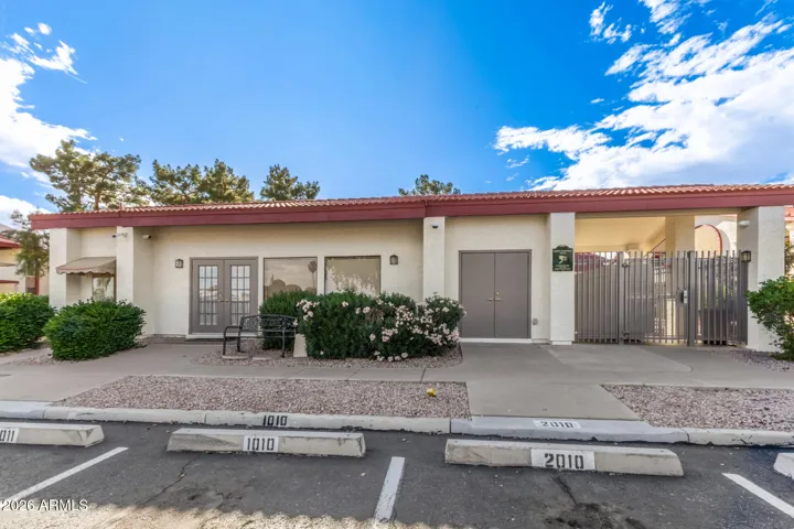 Front of Building by Pool and Enclosed Mailboxes Gated