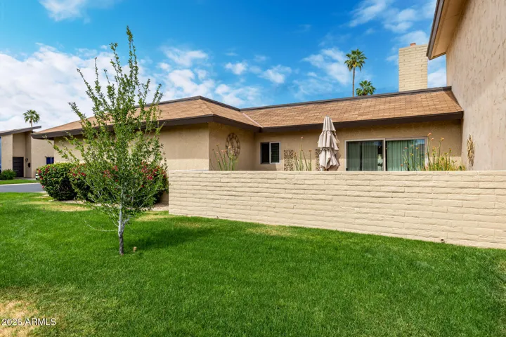 South patio sides to oversized grass corner lot