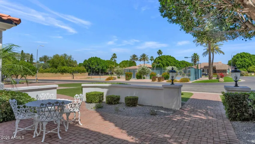 From the property
looking outward the lush irrigated grounds and mature tree canopy create a sense of privacy and depth that is rare within any gated community. This is a home that lives as beautifully on the outside as it does within.