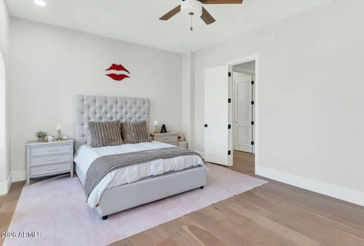 A generously proportioned second-floor bedroom with warm hardwood flooring and access to the shared Jack-and-Jill bathroom. Light, airy, and finished with the same quiet elegance found throughout the home. This bedroom shares the Jack & Jill bath.