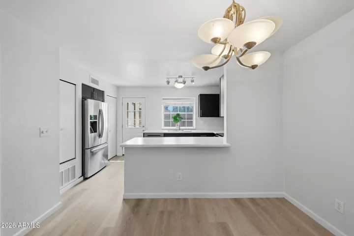 Dining Area & Kitchen with door to patio.