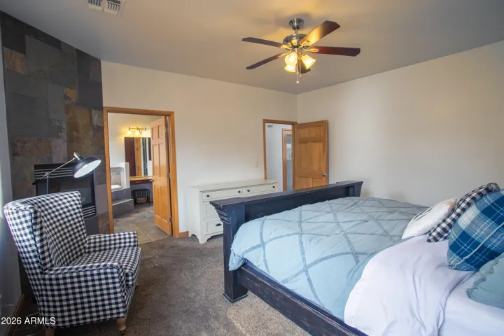 Primary Bedroom w/ Fireplace and Bathroom
