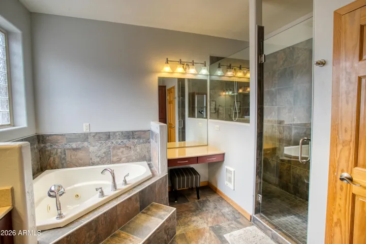 Primary Bathroom w/ Large Tub & Vanity