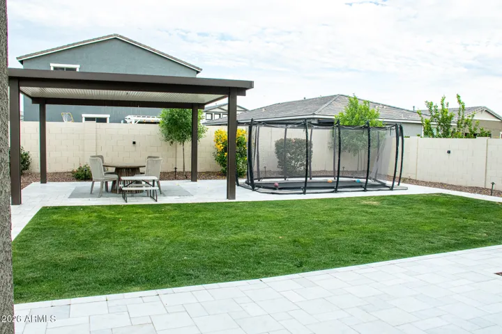 Outdoor pergola and built in trampoline.