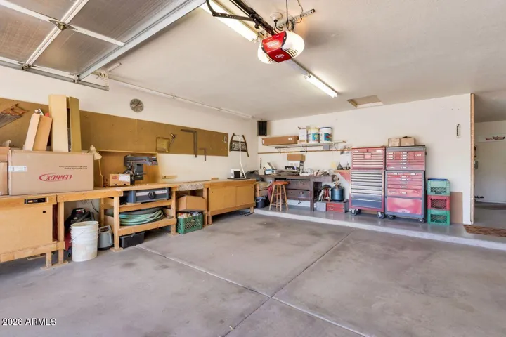 Oversize garage with workbench and abundant storage